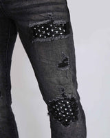 Black Ripped Jeans with Striking Black Patches